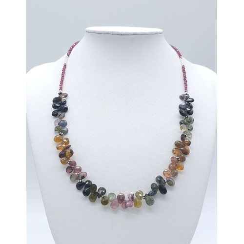 714B - A unique, Tourmaline & Garnet gemstone beaded necklace with a 925 Silver clasp.
Measuring 46cm in le... 