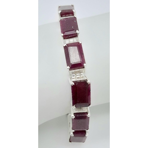 741B - A Square-Cut, Ruby gemstone tennis bracelet, set in Sterling Silver. This stylish bracelet measures ... 