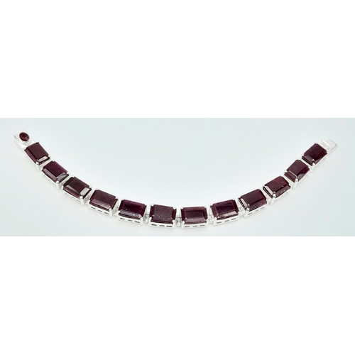 741B - A Square-Cut, Ruby gemstone tennis bracelet, set in Sterling Silver. This stylish bracelet measures ... 