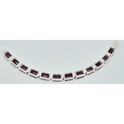 741B - A Square-Cut, Ruby gemstone tennis bracelet, set in Sterling Silver. This stylish bracelet measures ... 