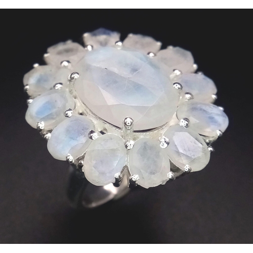 763B - An iridescent Moonstone, Sterling Silver Cocktail Ring.
Wonderful floral design that shimmers and gl... 