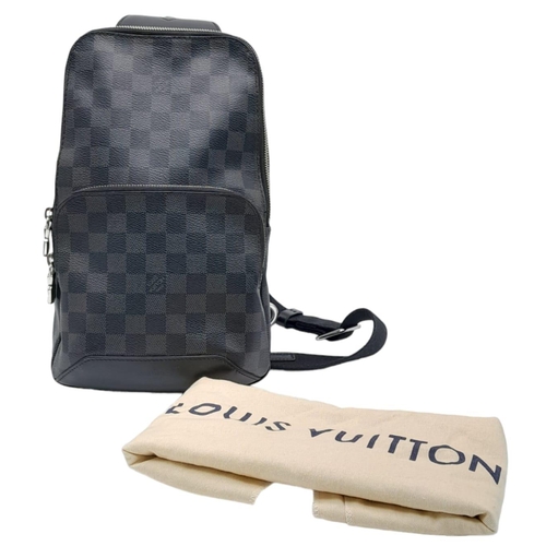 303 - A Louis Vuitton Avenue Slingbag. Checked graphite canvas exterior with zipped compartment. Silver to... 