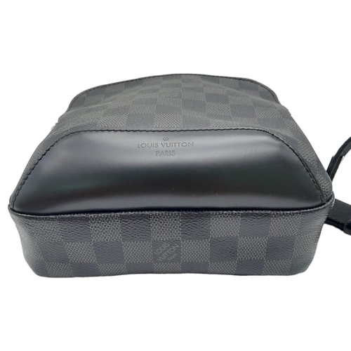 303 - A Louis Vuitton Avenue Slingbag. Checked graphite canvas exterior with zipped compartment. Silver to... 