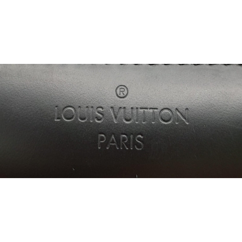 303 - A Louis Vuitton Avenue Slingbag. Checked graphite canvas exterior with zipped compartment. Silver to... 