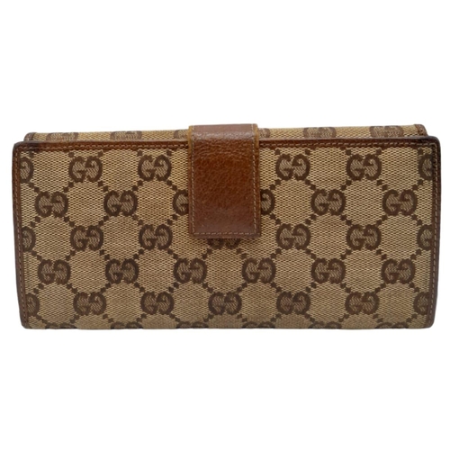 555 - A Classic Gucci Monogram Wallet. Comes with case and receipt. 19cm x 10cm. Ref: 15396