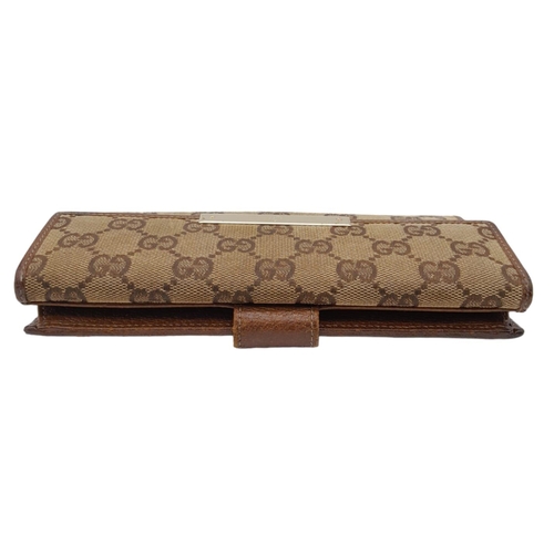 555 - A Classic Gucci Monogram Wallet. Comes with case and receipt. 19cm x 10cm. Ref: 15396