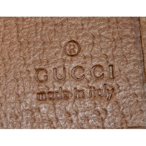 555 - A Classic Gucci Monogram Wallet. Comes with case and receipt. 19cm x 10cm. Ref: 15396