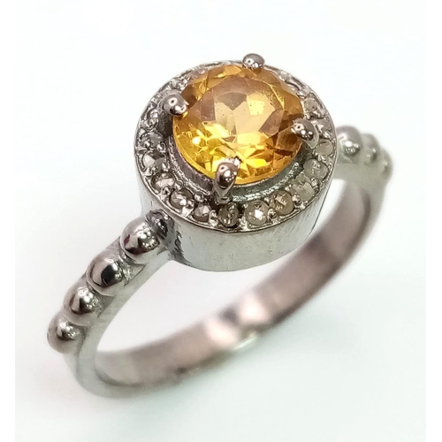 694B - A 1.5CT Citrine with 0.22CT Rose cut Diamonds set in a 925 silver ring. Total weight 3.9G. Size N. C... 