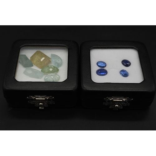 709B - Two Lots of Gemstones: 42.45ctw aquamarine and 6.10ctw kyanites. In presentation/storage boxes.