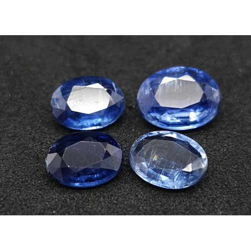 709B - Two Lots of Gemstones: 42.45ctw aquamarine and 6.10ctw kyanites. In presentation/storage boxes.