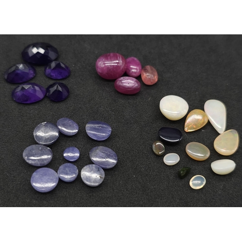 708B - Four Gemstone Lots: 26.25ctw ruby cabochons, 11ctw Ethiopian opals, 19.6ctw tanzanite and 20.35ctw o... 