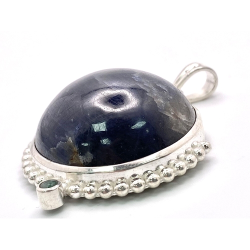 716B - A 166.5ct Huge Blue Sapphire Cabochon 925 Silver Pendant. 66.55ct. W- 42g. 5.5cm. Comes with a prese... 