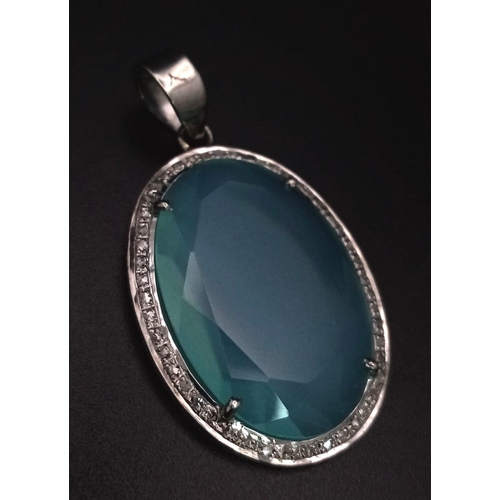 670B - An 18.5CT Oval shape Chalcedony with 0.25CT Rose cut Diamonds set in a 925 silver pendant. Total wei... 