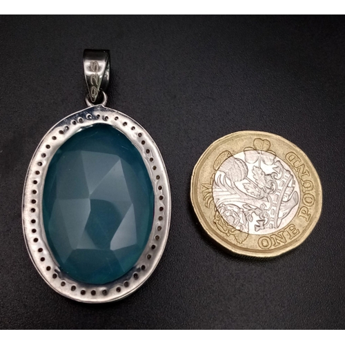 670B - An 18.5CT Oval shape Chalcedony with 0.25CT Rose cut Diamonds set in a 925 silver pendant. Total wei... 