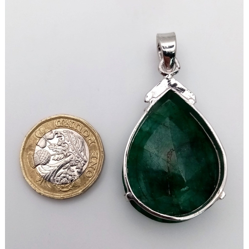 751B - A Large Emerald Pear-Shape 925 Silver Pendant. 65ct. 5.5cm. 19g total weight. Comes with a presentat... 