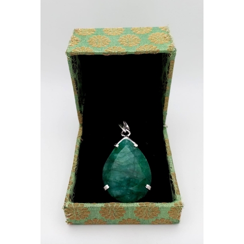 751B - A Large Emerald Pear-Shape 925 Silver Pendant. 65ct. 5.5cm. 19g total weight. Comes with a presentat... 