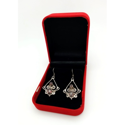 743B - A Pair of 925 Silver and Garnet Art Deco Style Earrings. Comes with a presentation case.