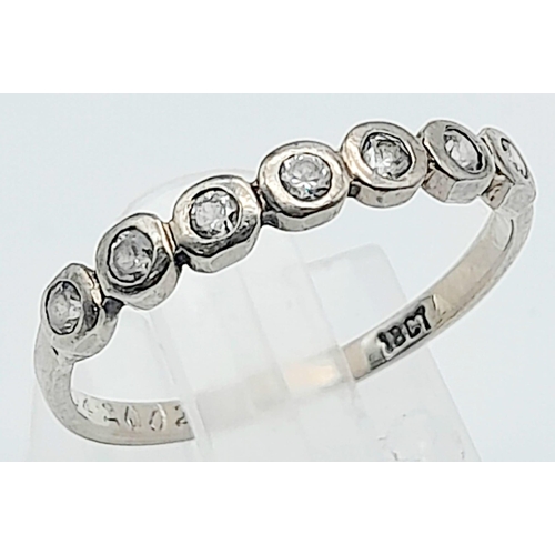 781B - A delightful, 18KT White Gold, Seven Stone Ring.
Size: N/O
Weight: 1.88g