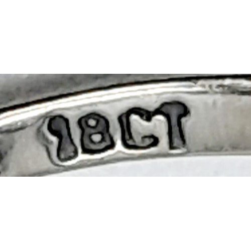 781B - A delightful, 18KT White Gold, Seven Stone Ring.
Size: N/O
Weight: 1.88g