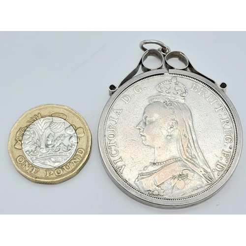 240 - An 1889 Victorian Silver Crown Coin. Encased in a pendant setting. Good definition.