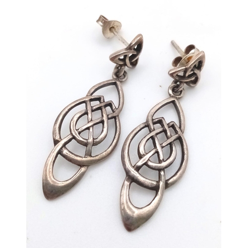 948B - A pair of 925 silver Celtic drop earrings, Come with a silver Celtic knot ring with size N. Total we... 