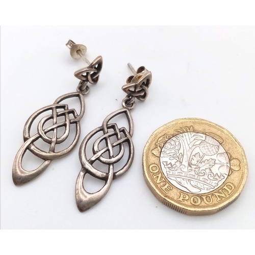 948B - A pair of 925 silver Celtic drop earrings, Come with a silver Celtic knot ring with size N. Total we... 