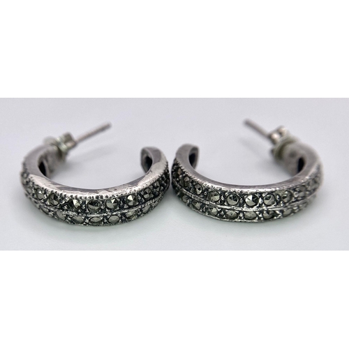 949B - A collection of 3 pairs of 925 silver stud earrings and a pair of silver hoop earrings. Total weight... 