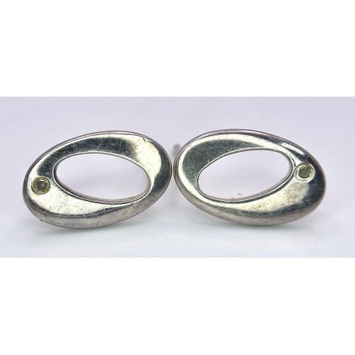 949B - A collection of 3 pairs of 925 silver stud earrings and a pair of silver hoop earrings. Total weight... 