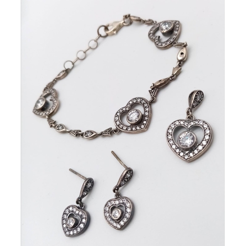 947B - A set of 925 silver Cubic Zirconia heart jewellery include a pair of earrings, a pendant and a 19cm ... 