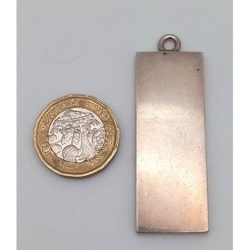 113 - A vintage sterling silver ingot pendant (2X5cm). Full Birmingham hallmarks, 1977. Total weight28G.