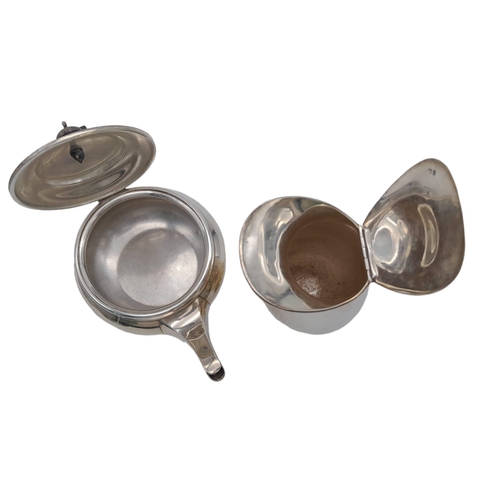 157 - An Antique Sterling Silver Art Deco Tea-Set. Includes: Teapot, hot water pitcher, cream and sugar ju... 