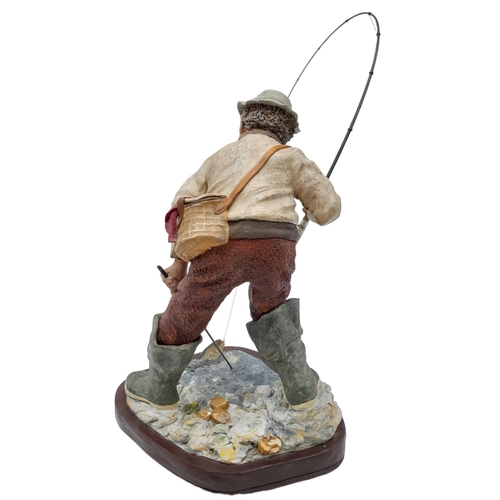 394 - A Hand-Made Colin George Fisherman Sculpture. 26cm tall plus rod! Comes with a signed photo.