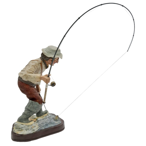 394 - A Hand-Made Colin George Fisherman Sculpture. 26cm tall plus rod! Comes with a signed photo.