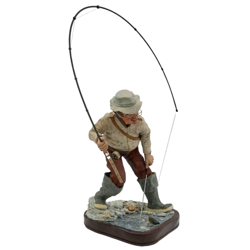 394 - A Hand-Made Colin George Fisherman Sculpture. 26cm tall plus rod! Comes with a signed photo.