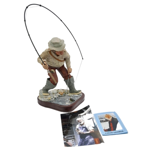 394 - A Hand-Made Colin George Fisherman Sculpture. 26cm tall plus rod! Comes with a signed photo.