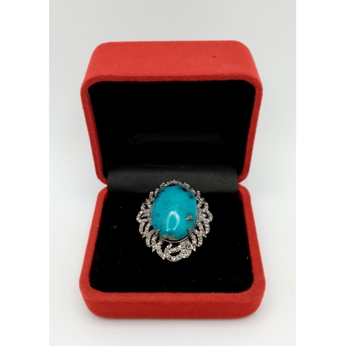 834B - A wonderful 18ct Turquoise, Sterling Silver Ring.
The central stone is surrounded by Diamonds, 0.8ct... 