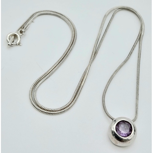 62 - A fancy 925 silver Amethyst pendant on silver snake  chain. Total weight 5G. Total length 42cm.