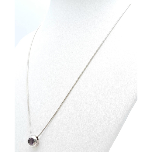 62 - A fancy 925 silver Amethyst pendant on silver snake  chain. Total weight 5G. Total length 42cm.