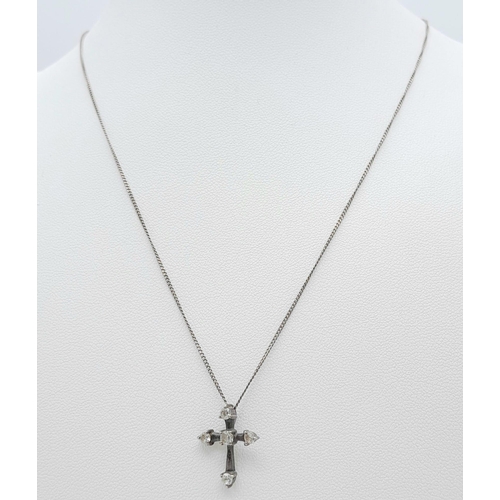 83 - A vintage 925 silver Cubic Zirconia cross pendant on Italy silver chain. Total weight 2.25G. Total l... 