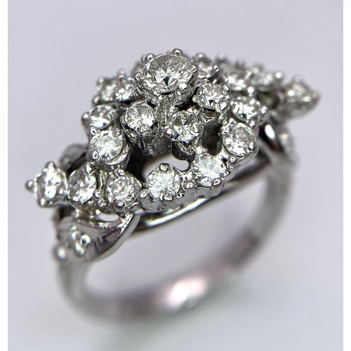 938B - A Fancy Cluster Ring - Set with 1.1ctw of round cut diamonds. Set in white metal. Size O