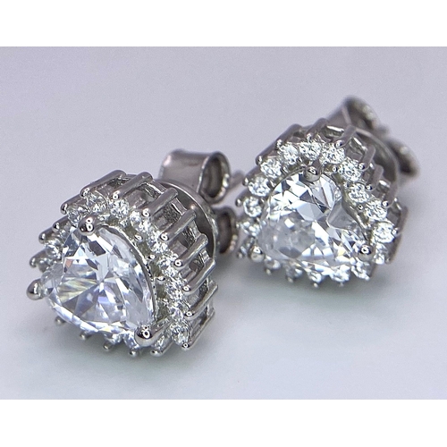 944B - A Pair of Silver Cluster Stud Earrings - Set with heart-shaped CZ and a halo of CZ.