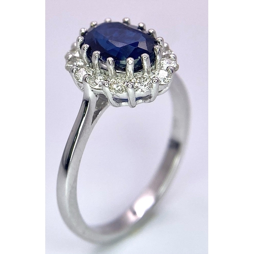 945B - A Certified 18K White Gold Oval Blue Kyanite and Round Brilliant Cut Diamond Cluster Ring. Kyanite -... 