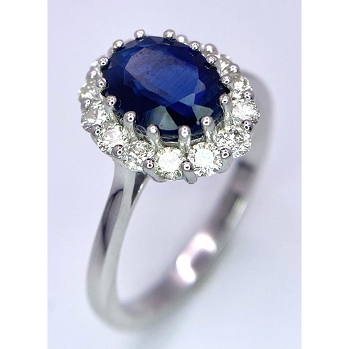 945B - A Certified 18K White Gold Oval Blue Kyanite and Round Brilliant Cut Diamond Cluster Ring. Kyanite -... 