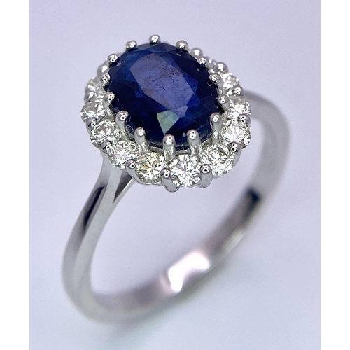 945B - A Certified 18K White Gold Oval Blue Kyanite and Round Brilliant Cut Diamond Cluster Ring. Kyanite -... 