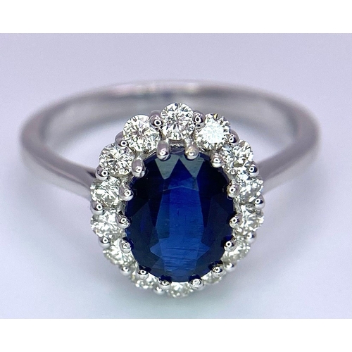 945B - A Certified 18K White Gold Oval Blue Kyanite and Round Brilliant Cut Diamond Cluster Ring. Kyanite -... 