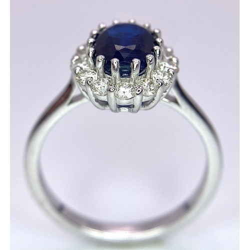 945B - A Certified 18K White Gold Oval Blue Kyanite and Round Brilliant Cut Diamond Cluster Ring. Kyanite -... 