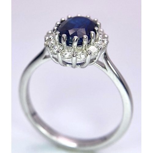 945B - A Certified 18K White Gold Oval Blue Kyanite and Round Brilliant Cut Diamond Cluster Ring. Kyanite -... 