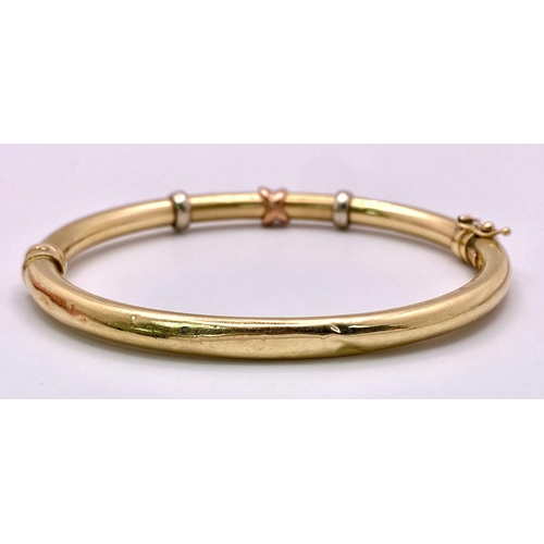 395 - A 9K Yellow Gold Vintage Torque Bangle. 6cm inner diameter. 8.16g weight.