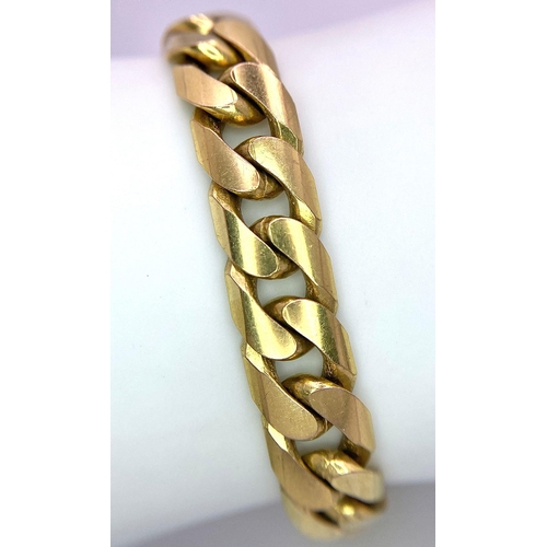 72 - A Chunky 9K Yellow Gold Flat Curb Link Bracelet. 19cm. 37.2g weight