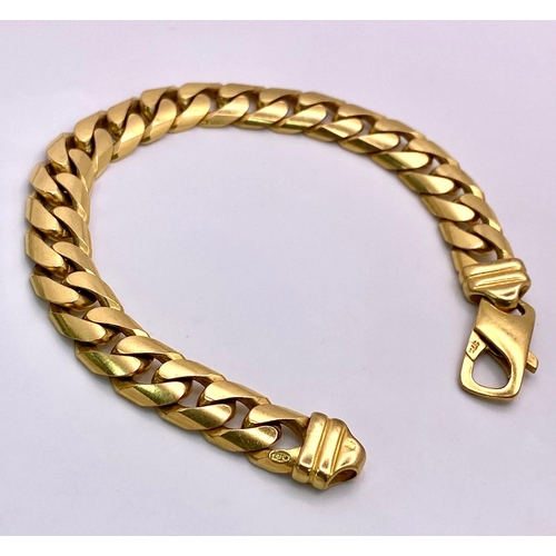 72 - A Chunky 9K Yellow Gold Flat Curb Link Bracelet. 19cm. 37.2g weight